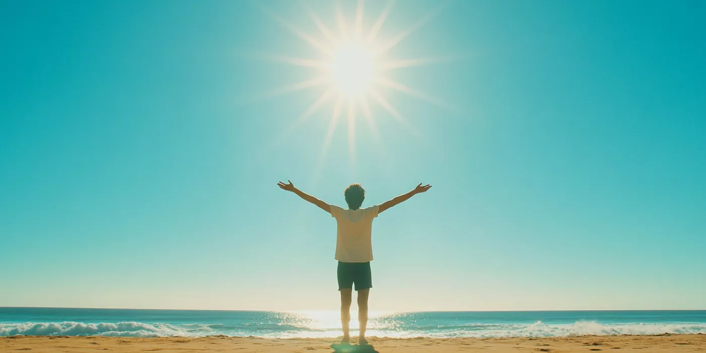A person basking in sunlight with a bright, clear sky