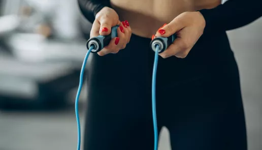 Woman using jumping rope gym