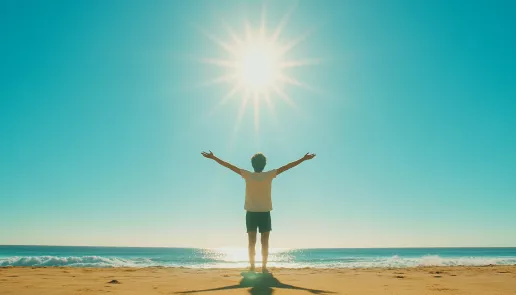 A person basking in sunlight with a bright, clear sky