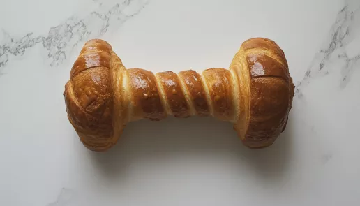 croissant dumbbell, white background, carbohydrates